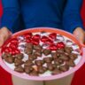Photo Of Person Holding Tray Of Heart Shaped Chocolates